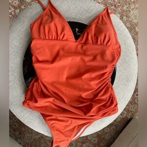 One piece orange ruched waist swimsuit approximate size 8/10 no tags never worn
